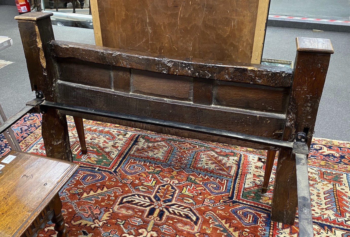 A 17th century style carved oak single head and foot bedstead, length 210cm, width 127cm, height 172cm